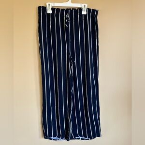 Navy and white striped trousers with a tie at the waist